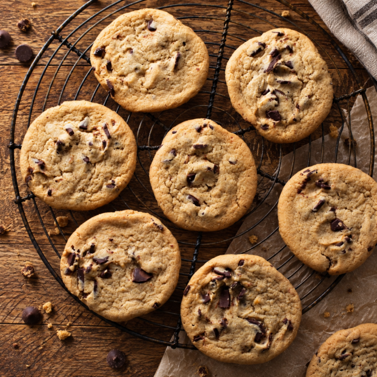 Homemade vegan chocolate chip cookies cooling on a wire rack